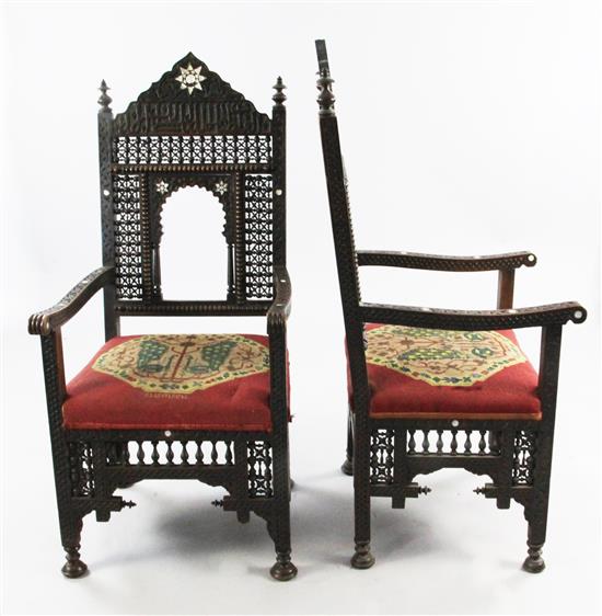 A late 19th century moorish open armchair and a similar armchair